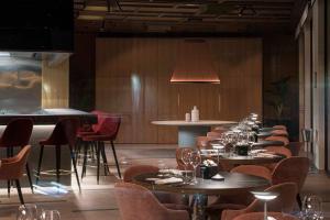 a row of tables and chairs in a restaurant at Europa Palace in Sanremo
