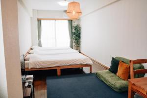 Postel nebo postele na pokoji v ubytování Tipy records inn room