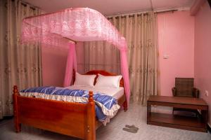 Postel nebo postele na pokoji v ubytování PK Sleek Suites