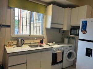 Η κουζίνα ή μικρή κουζίνα στο Departamento ISABELLA