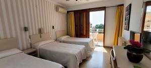 Postel nebo postele na pokoji v ubytování Hotel Tramontana