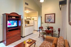 En TV eller et underholdningssystem på Casa Conde Hotel & Apartamentos