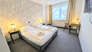 Postel nebo postele na pokoji v ubytování Hotel Panorama