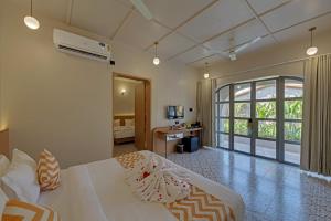 A bed or beds in a room at Villa Euphoria Resort at Statue of Unity