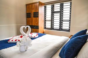 Postel nebo postele na pokoji v ubytování Ecostay inn