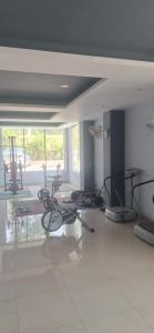 a room with a gym with exercise bikes in it at 2 BHK Apartment, Jalandhar in Jalandhar