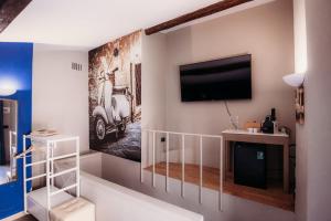 TV a/nebo společenská místnost v ubytování Hotel Domus Tiberina