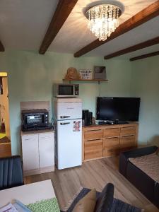 Kuchyň nebo kuchyňský kout v ubytování Feriendorf am Hohen Bogen - Haus 66