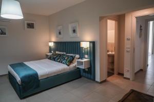 Postel nebo postele na pokoji v ubytování B&B Guida