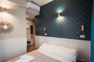 Postel nebo postele na pokoji v ubytování Hotel Domus Tiberina