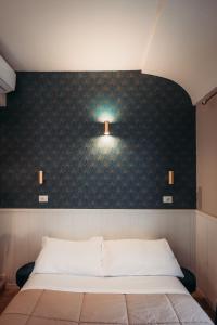 Postel nebo postele na pokoji v ubytování Hotel Domus Tiberina