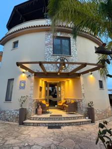 a house with a patio in front of it at Sun Tower beach apartments in Mazara del Vallo