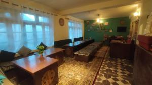 a living room with a couch and a table at Kyelang Times in Kyelang