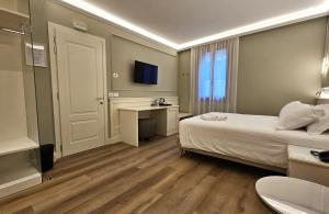 Voodi või voodid majutusasutuse Hotel Guerrini toas