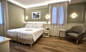 Voodi või voodid majutusasutuse Hotel Guerrini toas