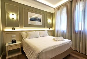 Voodi või voodid majutusasutuse Hotel Guerrini toas