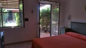 Voodi või voodid majutusasutuse Hotel Il Cipresso toas