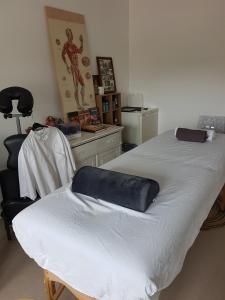 a room with two beds and a chair in it at Airbnb Meppel Centrum in Meppel