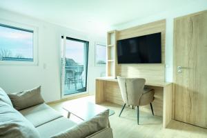 TV a/nebo společenská místnost v ubytování B&S Hotel