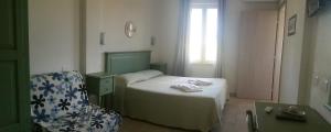 Voodi või voodid majutusasutuse Hotel Il Cipresso toas
