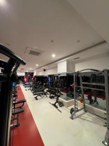 a gym with rows of chairs and machines at Granada Luxury Red Adult Only in Alanya