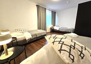 Giường trong phòng chung tại City Apartments