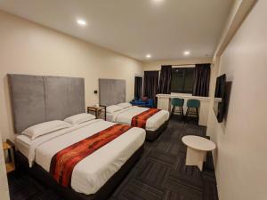 Pangkor Pop Ash Hotel客房内的一张或多张床位