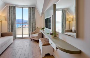 Телевизор и/или развлекательный центр в Asli Hotel