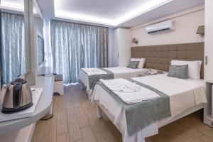 Кровать или кровати в номере Asli Hotel