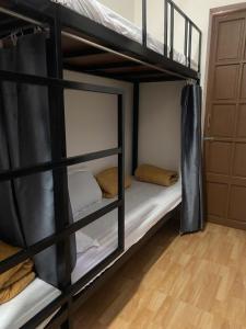Postel nebo postele na pokoji v ubytování AUMORI Hostel