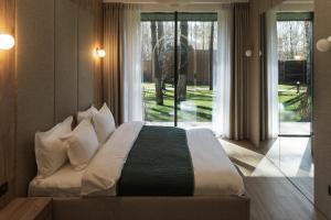 Postel nebo postele na pokoji v ubytování DOM hotel