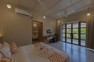 A bed or beds in a room at Villa Euphoria Resort at Statue of Unity
