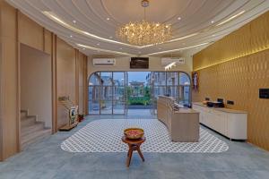 A television and/or entertainment centre at Villa Euphoria Resort at Statue of Unity
