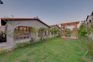 A garden outside Villa Euphoria Resort at Statue of Unity