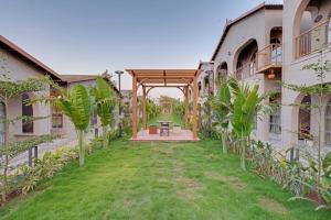 A garden outside Villa Euphoria Resort at Statue of Unity