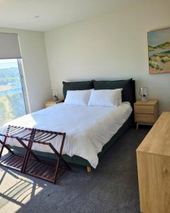 Ένα ή περισσότερα κρεβάτια σε δωμάτιο στο St Andrews Beach Golf Escape