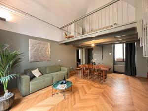 a living room with a couch and a table at Elena Suites - Boutique Apartments in Lecce
