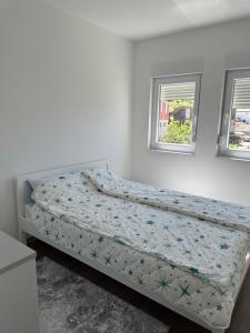 Ένα ή περισσότερα κρεβάτια σε δωμάτιο στο Bosanska Soba Mostar