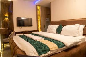 Postel nebo postele na pokoji v ubytování Norvits Hotel