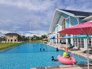 a group of people in a swimming pool at Phan Thiet Beach Villa in Bình Tú