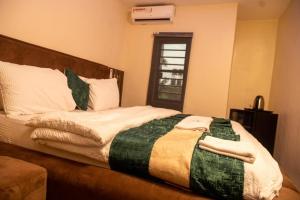 Postel nebo postele na pokoji v ubytování Norvits Hotel