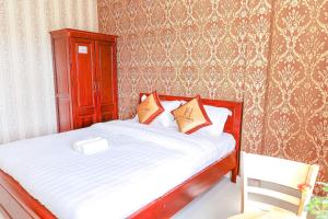 Postel nebo postele na pokoji v ubytování H Flower Hotel Đà Lạt - An An Hotel cũ