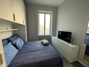 Una cama o camas en una habitación de bilocale Borgo Coscia