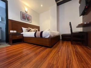 Ένα ή περισσότερα κρεβάτια σε δωμάτιο στο Hotel New Era