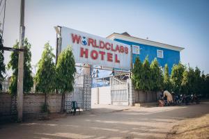 a building with a sign for a waldeloss hotel at World Class Hotel & Apartments in Abuja