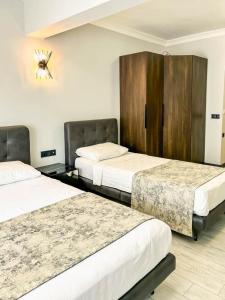 Кровать или кровати в номере Ida Hotel