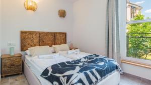 Postel nebo postele na pokoji v ubytování Apartamenty - Krynica Morska Enklawa I