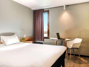 Postel nebo postele na pokoji v ubytování ibis Strasbourg Sud La Vigie
