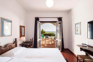 Postel nebo postele na pokoji v ubytování Hotel Le Dune
