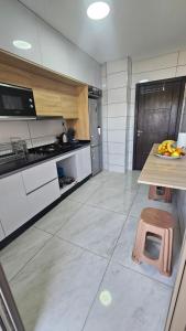 a kitchen with a counter with bananas on a table at Appartement Nador in Nador